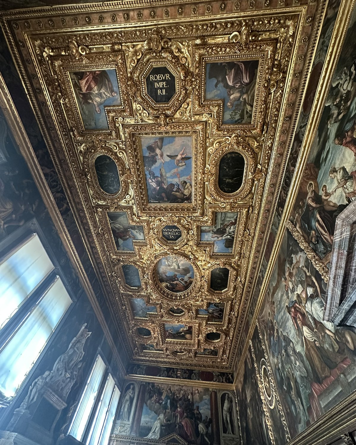 Ornate painted ceiling inside Doge's Palace in Venice