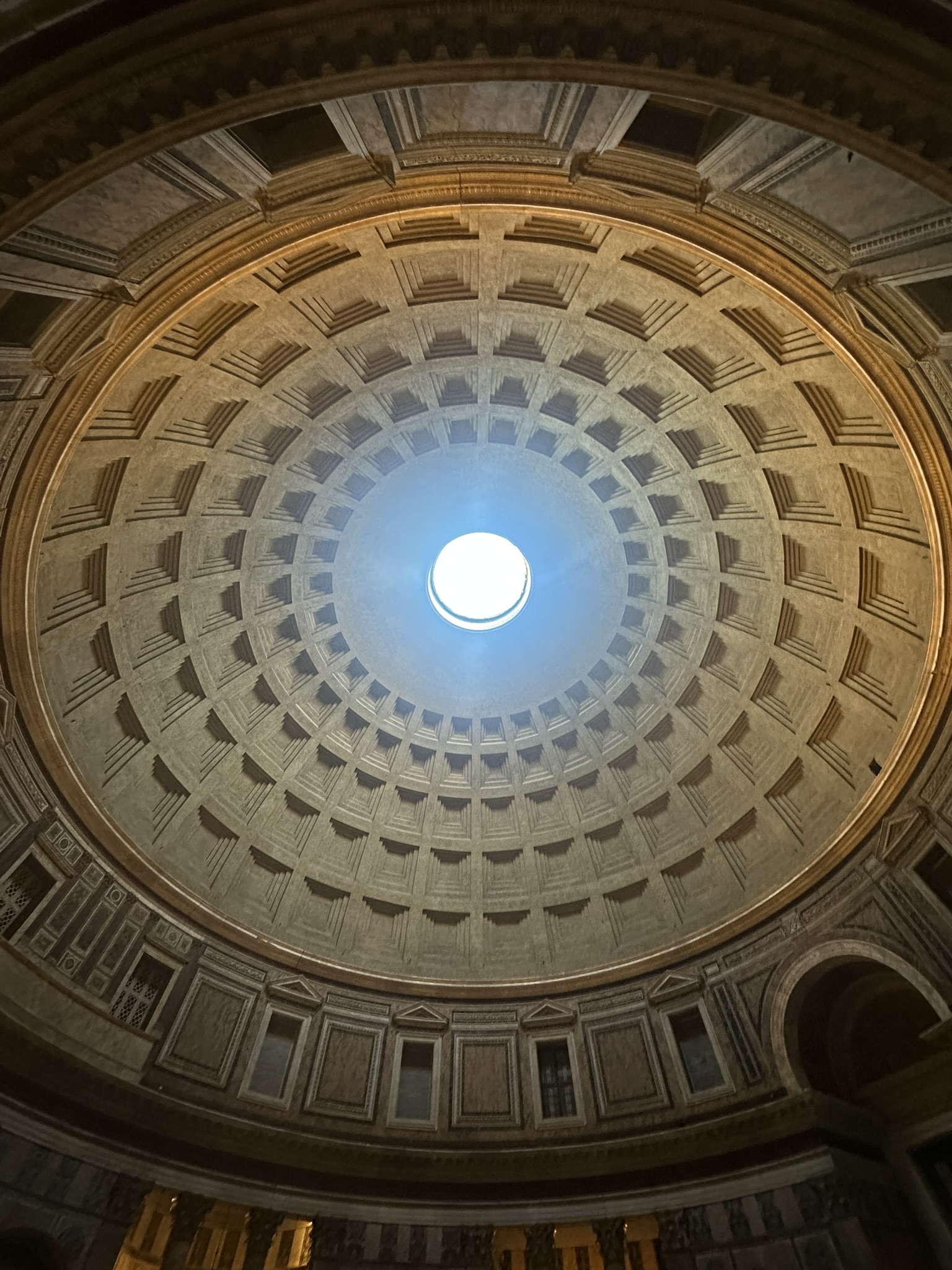 Looking up toward the open oculus in the Pantheon's ancient concrete dome