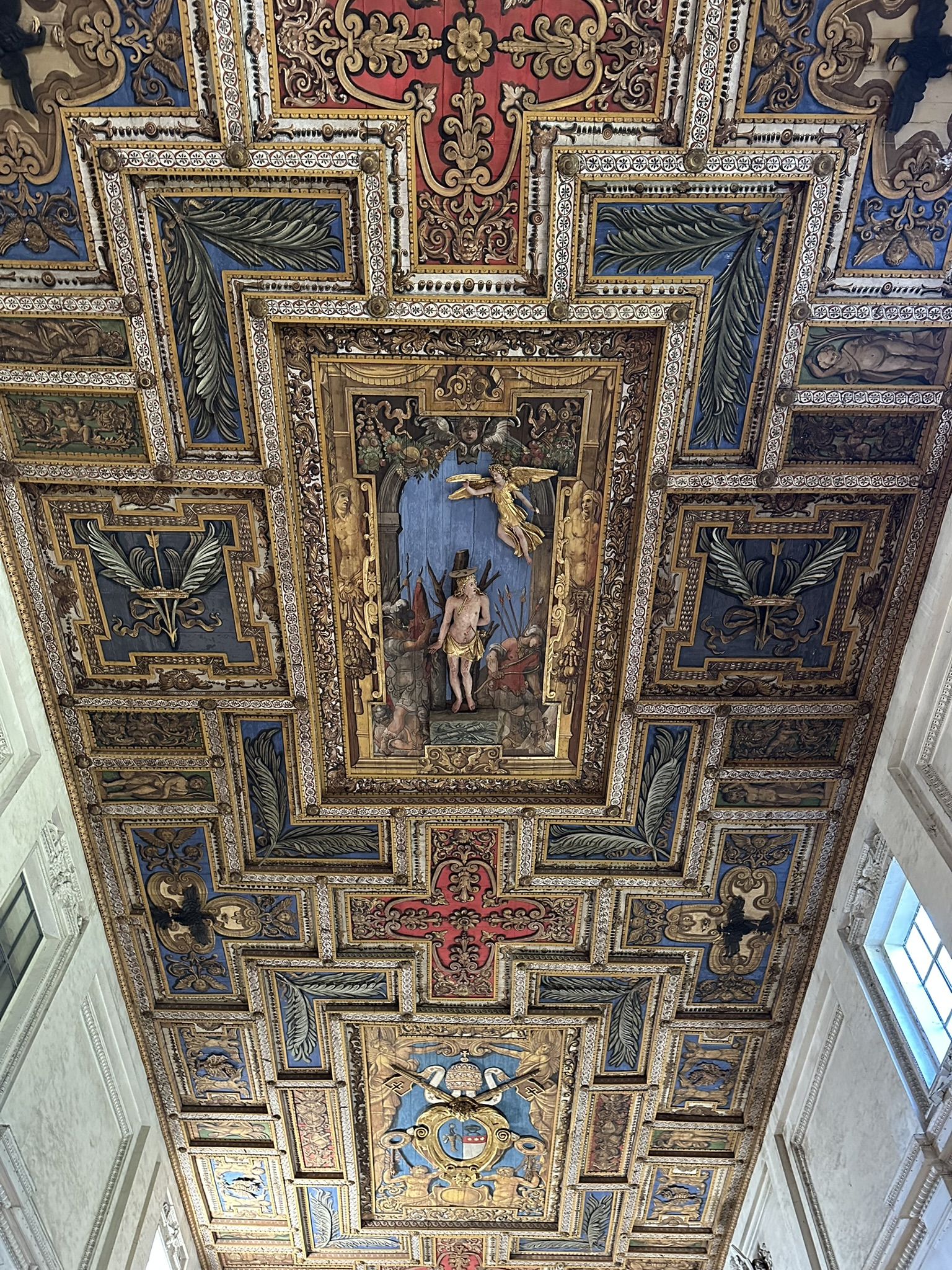 Ornate gilded coffered ceiling inside the Basilica of San Sebastiano fuori le Mura in Rome